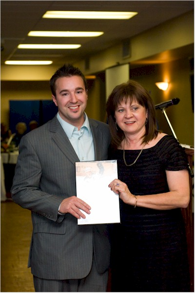 Kelly Kisio&apos;s son accepting on his behalf.